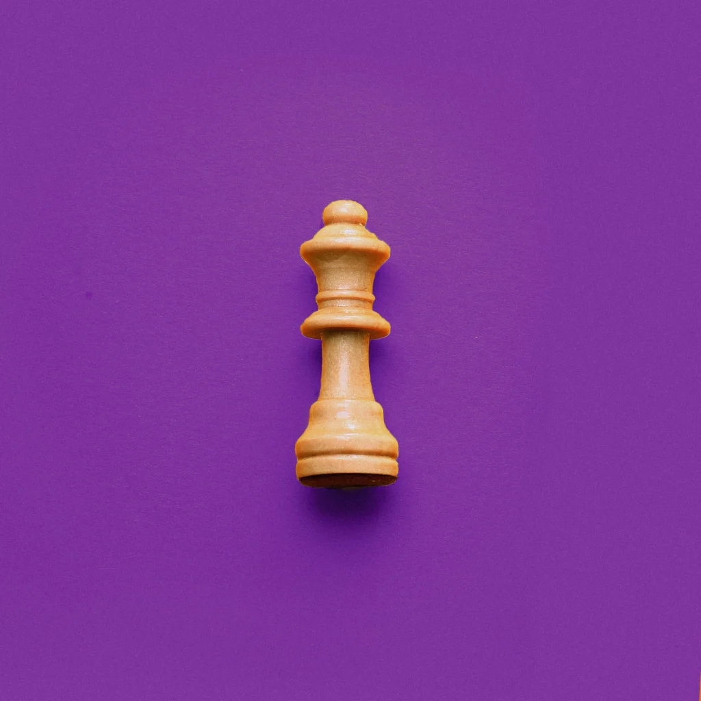 Chess piece on purple background.