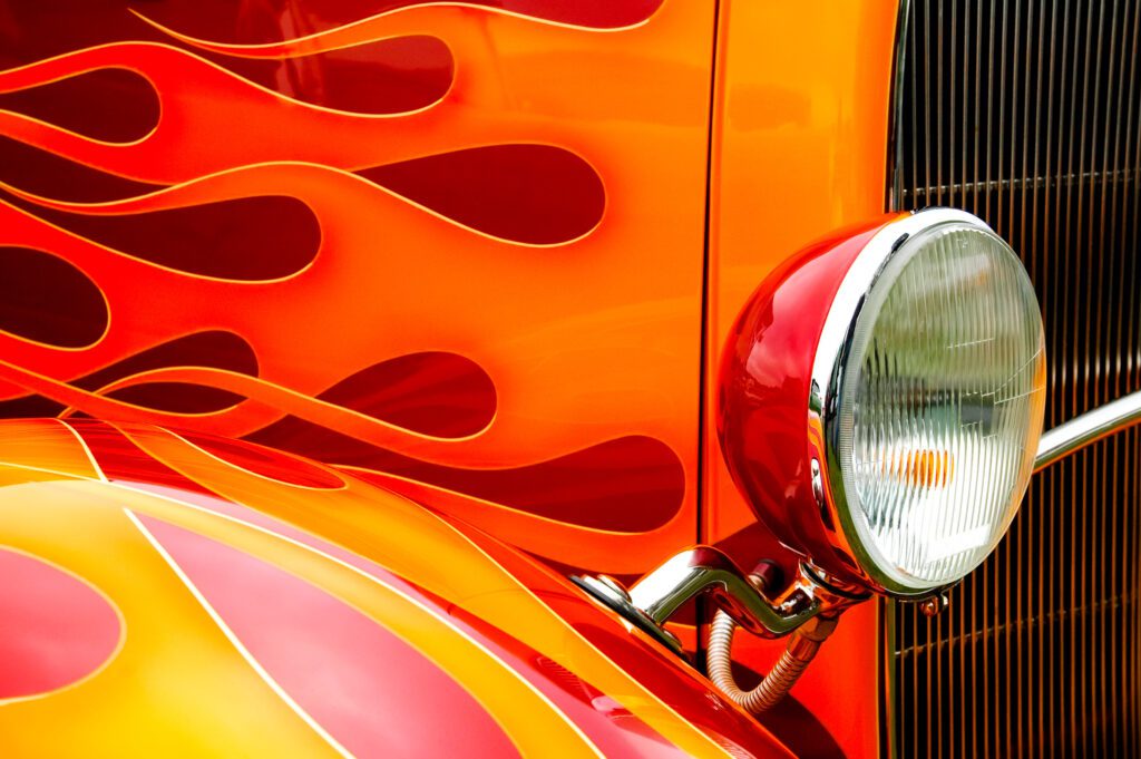 colorful flaming paintwork and headlamp on a custom hotrod