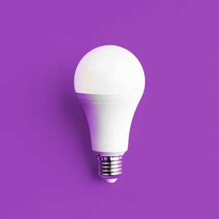Lightbulb on purple background.