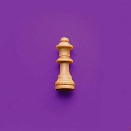 Chess piece on purple background.