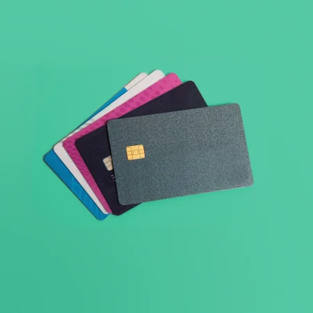 Credit cards on a mint green background.